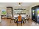 Dining area featuring a modern table, stylish chairs, and natural light from the window at 521 Cummings St, Sarasota, FL 34242