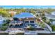 Waterfront home featuring a private pool, boat dock, and an outdoor deck perfect for entertaining and enjoying water views at 521 Cummings St, Sarasota, FL 34242