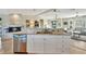 Kitchen island and view of fireplace at 521 Cummings St, Sarasota, FL 34242