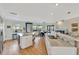 Bright, modern kitchen with granite countertops, stainless steel appliances, and an island with a sink at 521 Cummings St, Sarasota, FL 34242