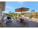 Outdoor deck with grill and dining table, perfect for entertaining and relaxing at 521 Cummings St, Sarasota, FL 34242