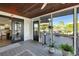 Inviting screened porch with dining area and seating area, seamlessly connects indoor and outdoor living at 521 Cummings St, Sarasota, FL 34242