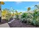 Beautifully landscaped yard with stepping stones, mulch and a variety of plants at 521 Cummings St, Sarasota, FL 34242