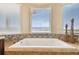 Relaxing bathtub with water views and a mosaic tile accent wall at 5531 2Nd Avenue W Cir, Palmetto, FL 34221
