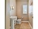 Small bathroom with pedestal sink and neutral tile flooring at 5531 2Nd Avenue W Cir, Palmetto, FL 34221