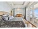 Main bedroom with king bed and private deck access at 5531 2Nd Avenue W Cir, Palmetto, FL 34221