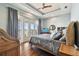 Main bedroom with king bed, water views, and balcony access at 5531 2Nd Avenue W Cir, Palmetto, FL 34221