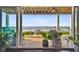 Deck overlooking the water with outdoor furniture and plants at 5531 2Nd Avenue W Cir, Palmetto, FL 34221