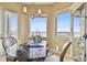 Elegant dining room with glass table and water views at 5531 2Nd Avenue W Cir, Palmetto, FL 34221