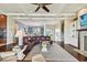 Spacious living room with a fireplace, hardwood floors, and large windows at 5531 2Nd Avenue W Cir, Palmetto, FL 34221