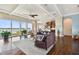 Living room with water views, hardwood floors, and a sectional sofa at 5531 2Nd Avenue W Cir, Palmetto, FL 34221