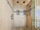 Spa-like shower with multiple shower heads and mosaic tile details at 5531 2Nd Avenue W Cir, Palmetto, FL 34221