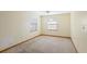 Simple bedroom with light beige walls and carpet at 6 Seminole Dr, Bradenton, FL 34208