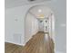 Light and bright entryway with arched hallway and wood flooring at 635 Jamaica E Cir, Apollo Beach, FL 33572