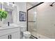 Modern bathroom with a walk-in shower and white vanity at 6418 Margarita Shores Ln, Apollo Beach, FL 33572