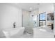 Spa-like bathroom with a freestanding tub and a large walk-in shower at 6418 Margarita Shores Ln, Apollo Beach, FL 33572