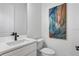 Modern bathroom with white vanity, quartz countertop, and black matte fixtures at 6418 Margarita Shores Ln, Apollo Beach, FL 33572