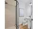 Modern bathroom with a walk-in shower, pedestal sink, and stylish fixtures at 6418 Margarita Shores Ln, Apollo Beach, FL 33572