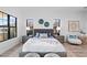 Bright bedroom with a comfortable bed, hardwood floors, and large windows at 6418 Margarita Shores Ln, Apollo Beach, FL 33572