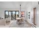 Elegant dining room with wooden table, chairs, and access to a balcony at 6418 Margarita Shores Ln, Apollo Beach, FL 33572