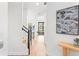 Modern entryway with light wood floors, open concept, and stairs at 6418 Margarita Shores Ln, Apollo Beach, FL 33572
