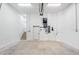 Bright and clean garage featuring an interior door and stairs leading to the home's interior at 6418 Margarita Shores Ln, Apollo Beach, FL 33572