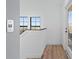 Upstairs hallway with access to bedrooms and balcony at 6418 Margarita Shores Ln, Apollo Beach, FL 33572