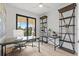 Home office with built-in shelving, a large desk, and plenty of natural light at 6418 Margarita Shores Ln, Apollo Beach, FL 33572