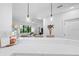 Modern kitchen with white cabinets, a breakfast bar, and pendant lighting at 6418 Margarita Shores Ln, Apollo Beach, FL 33572