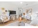 Spacious living room featuring a neutral color palette and comfortable seating at 6418 Margarita Shores Ln, Apollo Beach, FL 33572