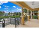 Relaxing patio overlooking a pond with a scenic view of the neighborhood at 6418 Margarita Shores Ln, Apollo Beach, FL 33572