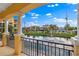 Covered patio with pond and neighborhood views; perfect for outdoor relaxation at 6418 Margarita Shores Ln, Apollo Beach, FL 33572