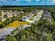 Aerial view showcasing a residential lot and surrounding homes at 7404 Mill Hopper Ct, Palmetto, FL 34221