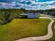 Aerial view of a vacant lot next to houses at 7404 Mill Hopper Ct, Palmetto, FL 34221