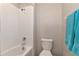 Bathroom featuring a shower/tub combination, tile, and toilet at 7404 Mill Hopper Ct, Palmetto, FL 34221
