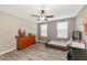 Charming bedroom with a twin bed, dresser, and ceiling fan at 7404 Mill Hopper Ct, Palmetto, FL 34221