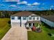 Two-story house with a two-car garage and landscaped yard at 7404 Mill Hopper Ct, Palmetto, FL 34221