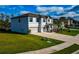 Two-story house with a two-car garage and front yard at 7404 Mill Hopper Ct, Palmetto, FL 34221