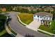 Two-story home with a neatly manicured lawn, a two-car garage, and a view of the neighborhood at 7404 Mill Hopper Ct, Palmetto, FL 34221