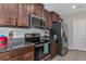 Kitchen features stainless steel appliances and granite countertops at 7404 Mill Hopper Ct, Palmetto, FL 34221