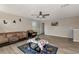 Cozy living room with hardwood floors, neutral paint and decor, and comfortable seating at 7404 Mill Hopper Ct, Palmetto, FL 34221