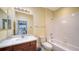 Bathroom with tub, toilet and vanity at 7616 Alumni Trl, Sarasota, FL 34243
