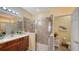 Bathroom with walk-in shower and tiled flooring at 7616 Alumni Trl, Sarasota, FL 34243