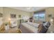 Comfortable bedroom with lake view and built-in workspace at 7616 Alumni Trl, Sarasota, FL 34243