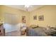Bedroom with double bed, chair, and closet at 7616 Alumni Trl, Sarasota, FL 34243