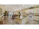 Open concept kitchen with granite island and breakfast bar at 7616 Alumni Trl, Sarasota, FL 34243