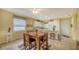 Kitchen with light cabinets, granite countertops, and a breakfast bar at 7616 Alumni Trl, Sarasota, FL 34243