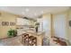 Bright kitchen with granite island and breakfast bar at 7616 Alumni Trl, Sarasota, FL 34243