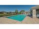 Community pool with a large deck and seating area at 7616 Alumni Trl, Sarasota, FL 34243