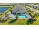 Community pool with a clubhouse and spa at 7616 Alumni Trl, Sarasota, FL 34243